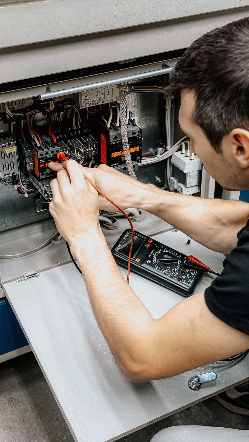 Electrician working on a consumer unit